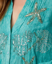 Abito chemisier acquamarina con ricami e paillettes stile marino