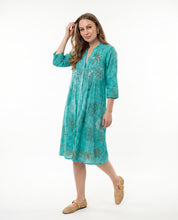 Abito chemisier acquamarina con ricami e paillettes stile marino