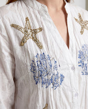 Abito chemisier bianco con ricami e paillettes stile marino