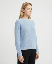 Maglione girocollo azzurro con spacchetti